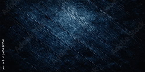 A dark blue grunge background features a textured vintage design with a weathered denim fabric pattern and old paper material for a blank indigo textile surface backdrop