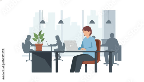 Modern office interior with employees working on laptops at desks, showcasing a productive and collaborative workspace