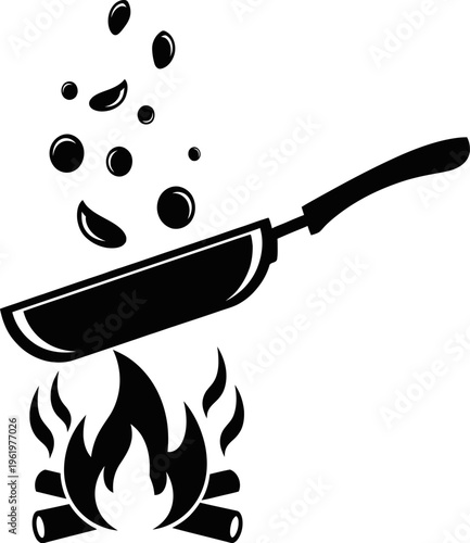 Sizzling skillet over flames with splat