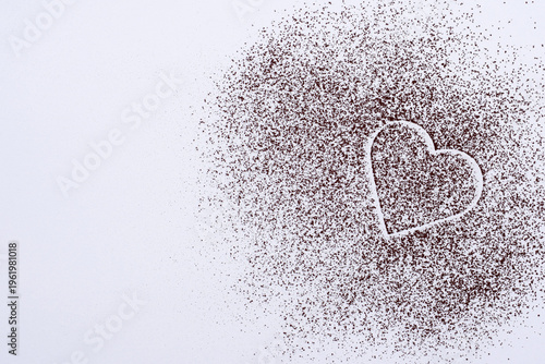 Cocoa powder on a white background, cocoa powder heart, copy space for text