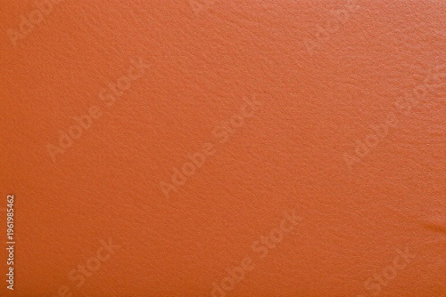 A close up of an orange leather texture