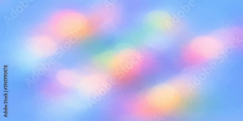 A vibrant abstract bokeh background featuring a soft blur of glowing colorful circles and bright holiday lights creates a shiny decorative pattern for a festive wallpaper design