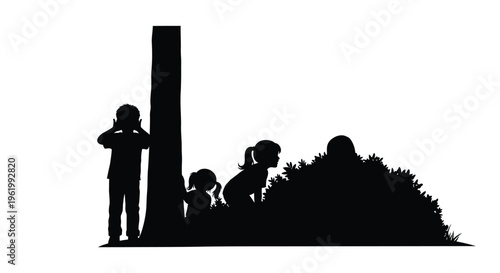 Children playing hide and seek amongst bushes a dark silhouette
