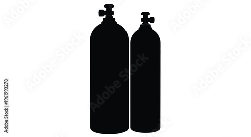 Two black scuba tanks stand side by side a striking silhouette