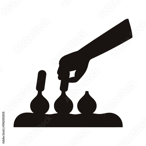 Hand manipulating objects in a row, possibly food or laboratory setting