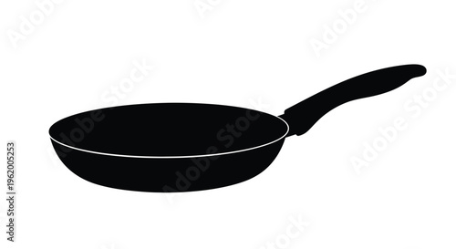 A black frying pan isolated on a plain white background silhouette