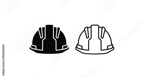 Two construction helmets one dark and one light in silhouette