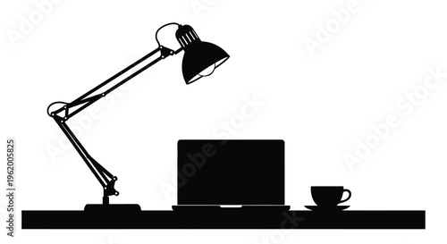 Desk setup with lamp laptop and cup a stark silhouette