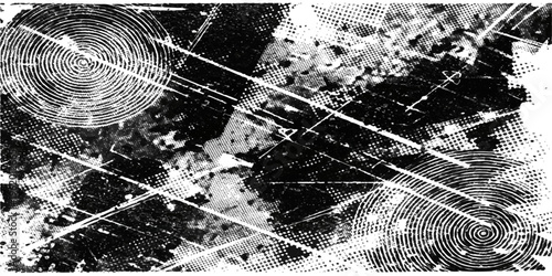 Abstract geometric composition, featuring overlapping circles and lines in a stark monochrome palette. This image is a study in texture and form, inviting viewers to explore its intricate layers.