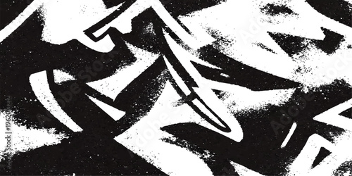 Abstract black and white dynamic graffiti art piece captures bold strokes and abstract forms creating a sense of urban style and artistic expression.