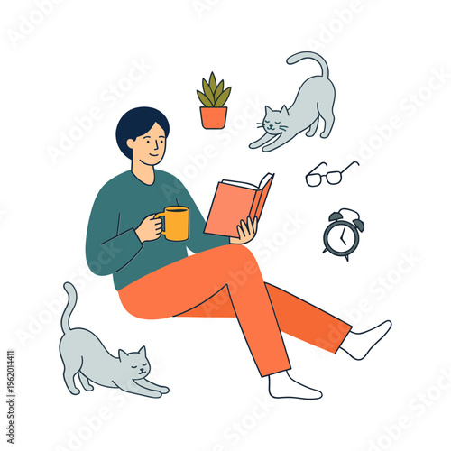 Woman reads a book while sitting with a cat and a cup