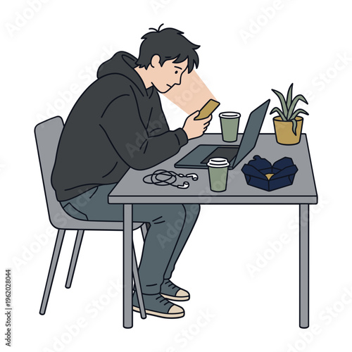 A man sits alone indoors at a table with a laptop phone and coffee struggling