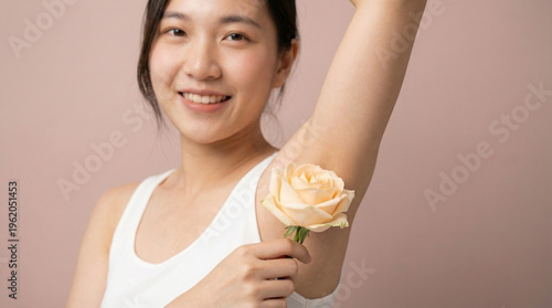 Smiling Young Asian Woman with Rose for Underarm Care