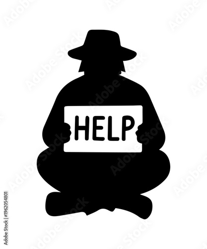 Silhouette of homeless man sitting and holding help sign