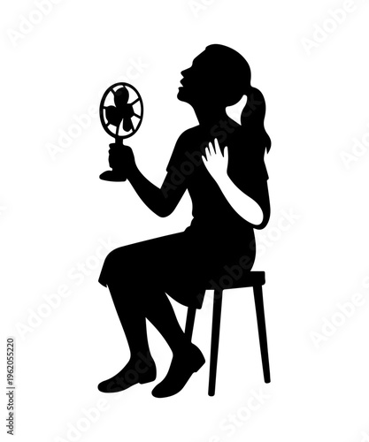 Woman suffering from heat using handheld fan