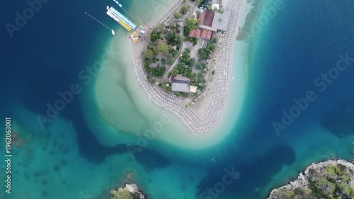 4K Aerial Drone View of Paradise Beach Island with White Sand, Crystal Clear Water and Sunbeds, Secluded Tropical Vacation