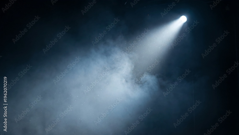 Fototapeta premium A spotlight shines brightly through smoke in a dark room with a beam of light.