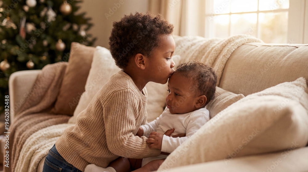 Fototapeta premium National Siblings Day older brother kissing baby brother with tender love showing sibling affection for family greeting cards social media content