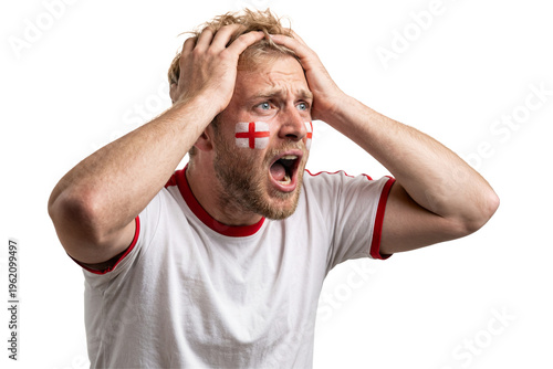 Stressed England football fan with face paint holding head in despair
