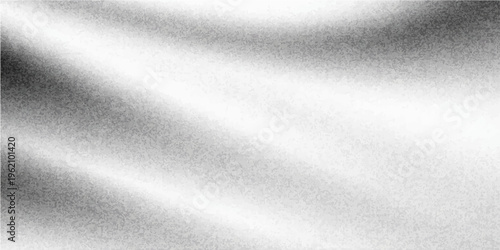 A textured cloth drapes gracefully, creating dynamic and intriguing patterns of light and shadow in a monochrome palette. The fabric's subtle folds and creases add depth.