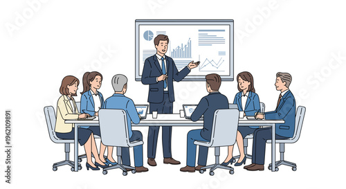 A male presenter in a dark suit addresses seven business professionals seated around a light grey table with laptops during a meeting.