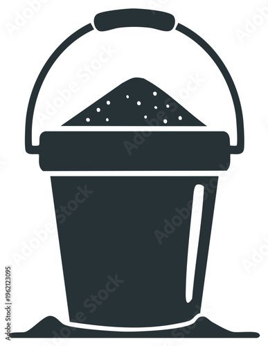 Dark colored bucket filled with sand with a handle