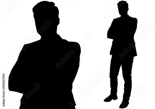 腕を組んで自信を見せるビジネスマンのシルエット