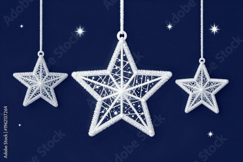 Three white stars hanging from strings on a blue background