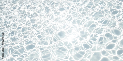 Abstract background of rippling water surface with bright sunlight reflections and fluid caustic patterns