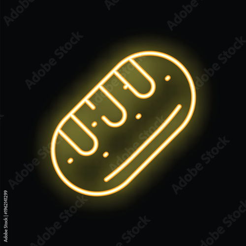 Yellow neon sign illustrating a loaf of bread, giving a warm glow on a dark background