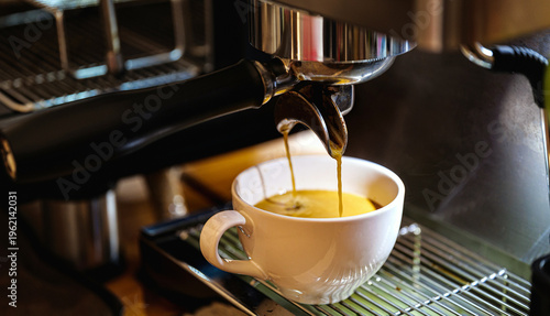 Fresh Espresso shot pouring into coffee cup from coffee machine-perfect crema