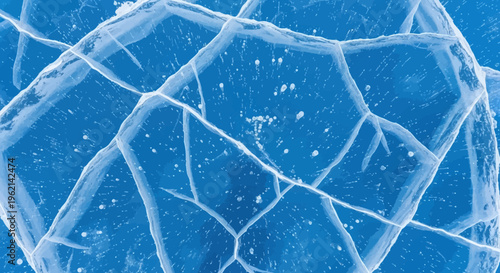 Close-up view of intricate cracks and patterns in a sheet of blue ice, showcasing the natural beauty of frozen water.