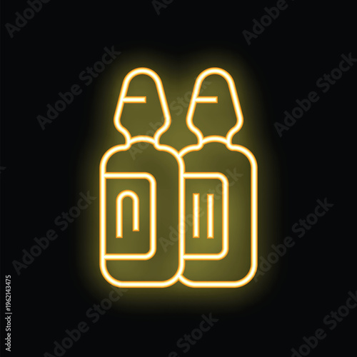Neon sign of two medical vials glowing yellow on black background, concept for pharmacy, drugstore and medicine