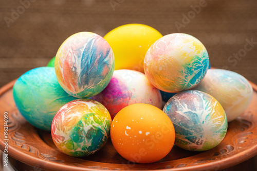 A vibrant collection of painted Easter eggs on a plate