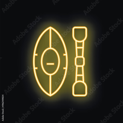 Neon sign illustrating a rugby ball and post glowing yellow on a black background