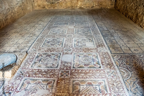 Fotografie Mosaic with geometric patterns on the floor of an underground room in an ancient