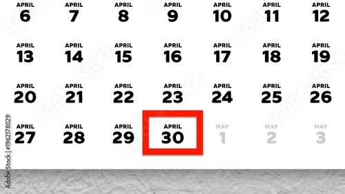 Close-up of the date April 30th marked with a red cursor on the wall calendar 2026