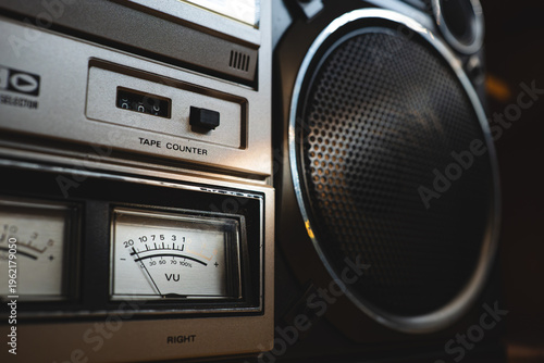 Fotografi Vintage 80's boombox stereo speaker and cassette player with vu meter in a retro home interior