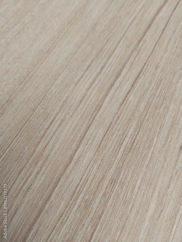Naklejka premium Light brown wood grain texture background. Natural timber pattern with straight fine lines. Ideal for minimalist furniture surface, laminate, and interior design backdrop.