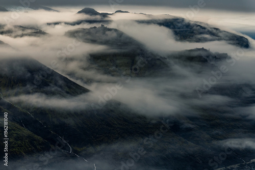 Фотография icelandic mountains covered in clouds