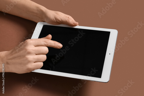 Female hands with tablet co...