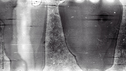 Blank grained film strip texture background with heavy grain, dust and light leak. Old expired moldy photographic film scan.
