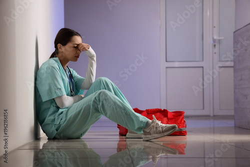 Female doctor with bag suff...