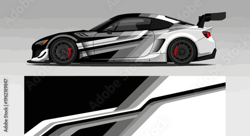 High-speed white sports car with bold black and gray graphics, sleek aerodynamic design on track.