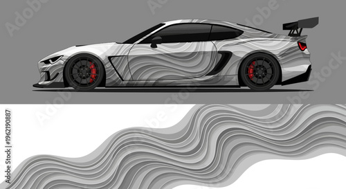 Sleek grey and black sports car with abstract graffiti pattern and flowing wave design.