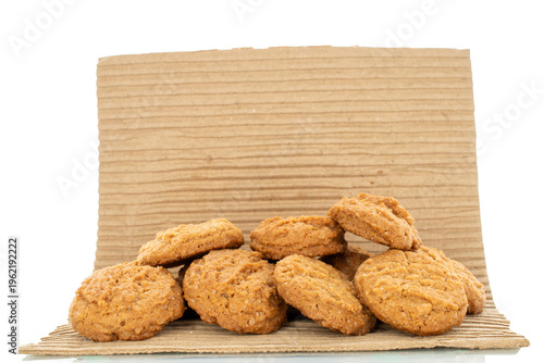 Oatmeal cookies with kitchen utensils on kraft paper, close-up. Top view.
