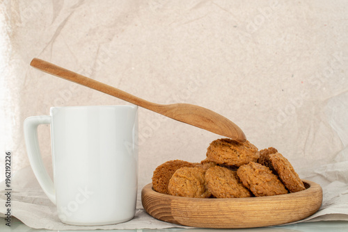 Oatmeal cookies with kitchen utensils on kraft paper, close-up. Top view.