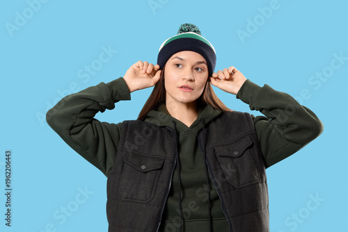 Young woman in hoodie with ...
