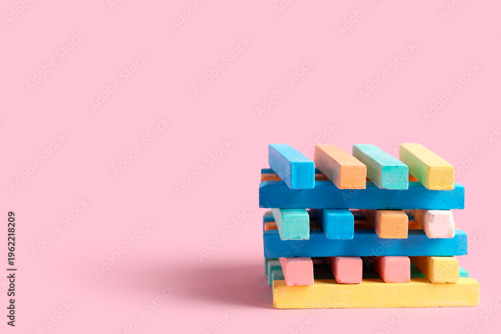 Fototapeta premium Colorful chalks on pink background