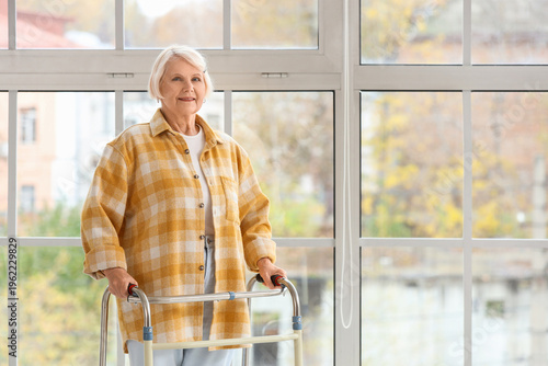 Senior woman with walker ne...